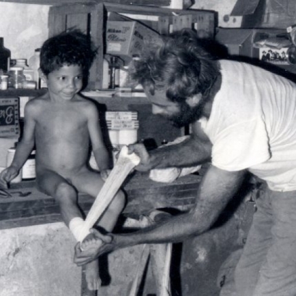 Wrapping the leg of an injured boy